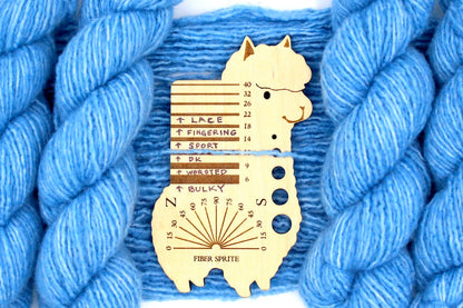 A skein of Light Baby Blue, Acrylic, Nylon, Wool, Cashmere, Dk Weight Yarn recycled by hand from unwanted sweaters draped over a Llama shaped Yarn weight tool. 
